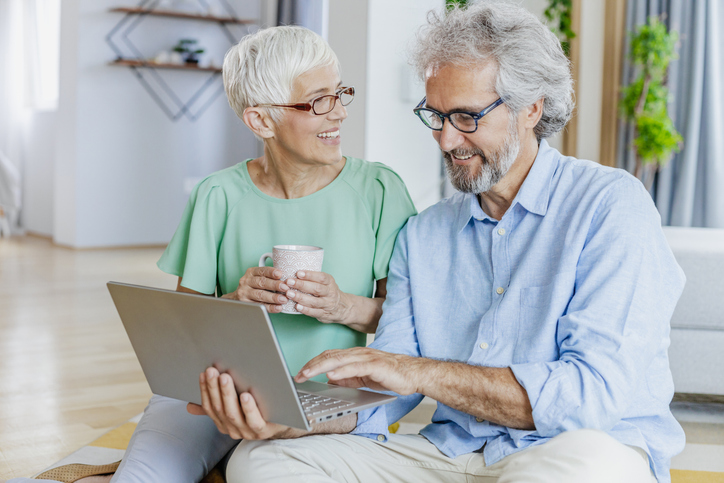 A senior couple reviewing their retirement plan.