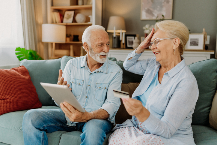 A senior couple calculating how much they could pay in taxes above the retirement earning limit.