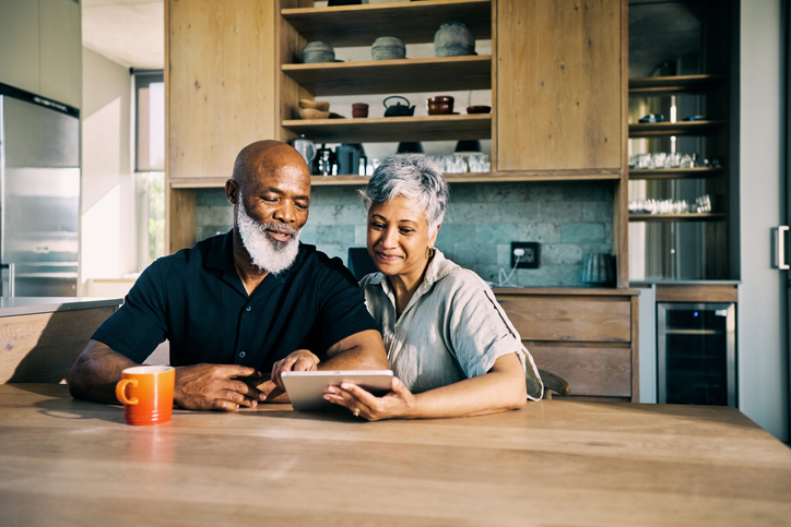 A senior couple reviewing their retirement plan.